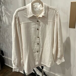 Cream colored Zara shirt with full sleeves.